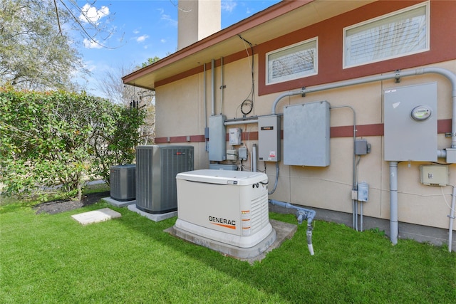 exterior space with stucco siding, a yard, a chimney, and central AC unit