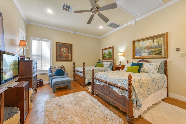 bedroom with baseboards, visible vents, attic access, and ornamental molding