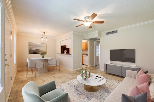 living room featuring light tile patterned flooring, a ceiling fan, visible vents, baseboards, and ornamental molding