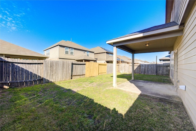 view of yard featuring a patio area and a fenced backyard