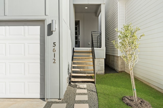 view of exterior entry featuring a garage