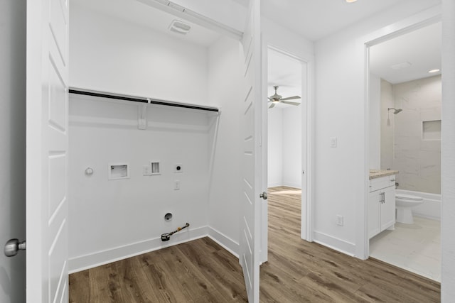 washroom with wood finished floors, hookup for an electric dryer, gas dryer hookup, ceiling fan, and hookup for a washing machine