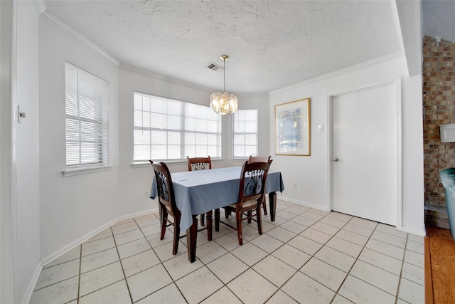 dining room with light tile patterned floors, plenty of natural light, a textured ceiling, and crown molding