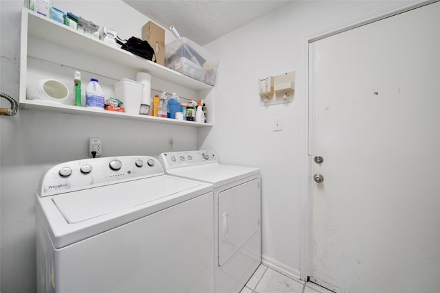 washroom featuring laundry area and washing machine and clothes dryer