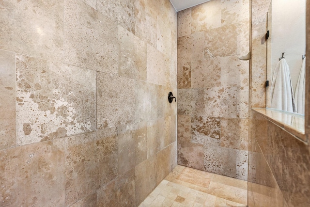 full bath with a tile shower