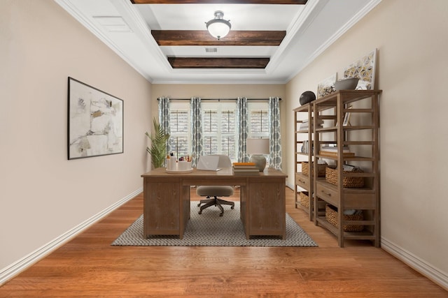 home office with ornamental molding, a tray ceiling, baseboards, and light wood finished floors