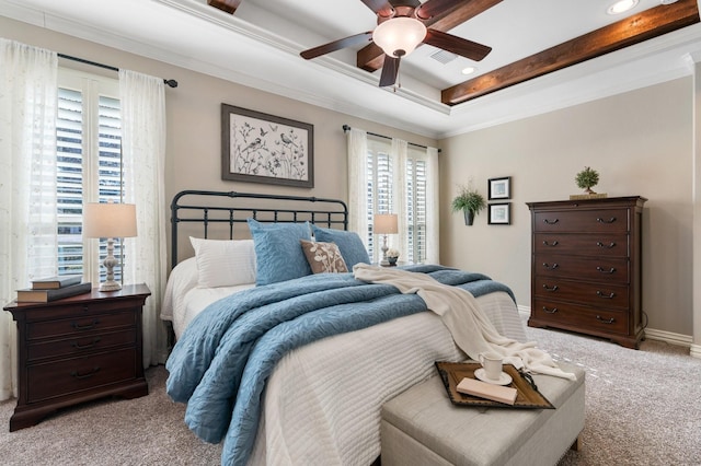 bedroom with ornamental molding, a tray ceiling, carpet flooring, and visible vents