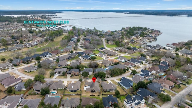 drone / aerial view with a residential view and a water view