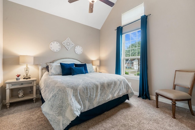 carpeted bedroom with baseboards, vaulted ceiling, and a ceiling fan