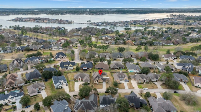 bird's eye view with a water view and a residential view