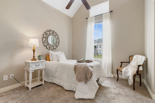 bedroom with lofted ceiling, multiple windows, light carpet, and baseboards