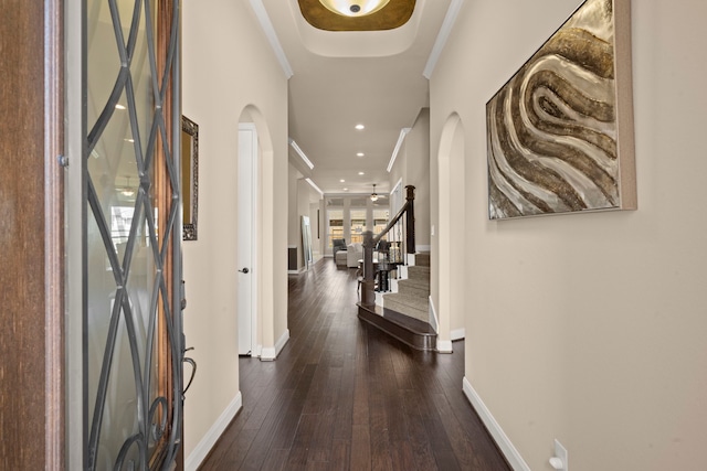 18419 Harlow Dr, Tomball, TX 77377 - entrance foyer with arched walkways, baseboards, crown molding, stairway, and hardwood / wood-style floors