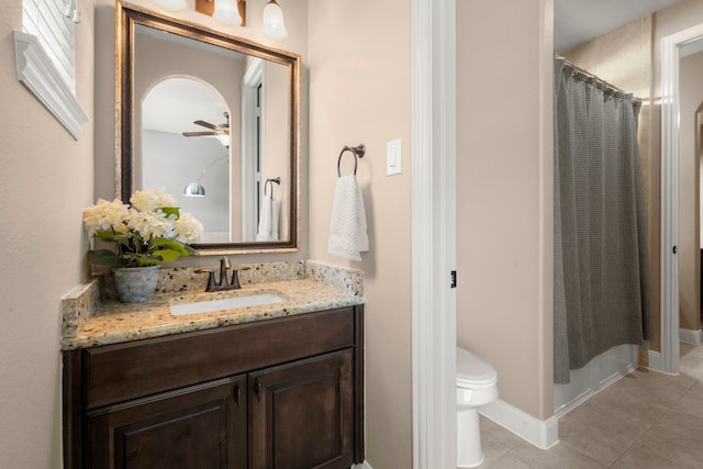 18419 Harlow Dr, Tomball, TX 77377 - full bathroom with tile patterned floors, vanity, toilet, a shower with shower curtain, and a ceiling fan