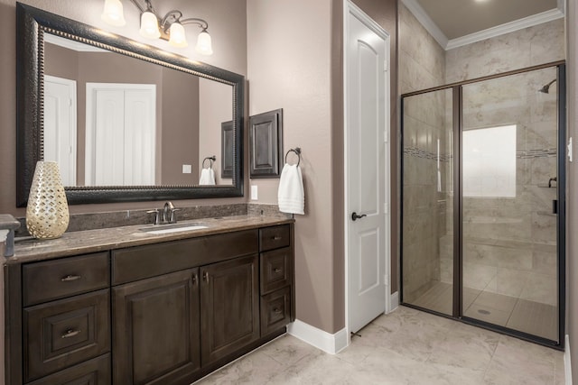 full bath featuring vanity, baseboards, marble finish floor, a stall shower, and crown molding