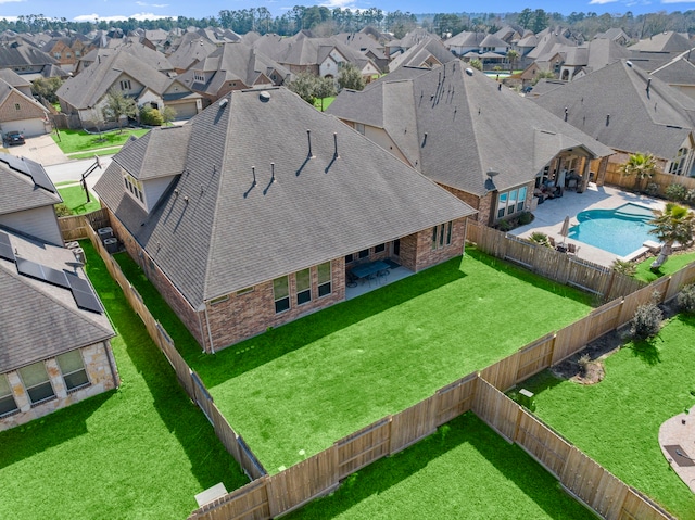 birds eye view of property with a residential view