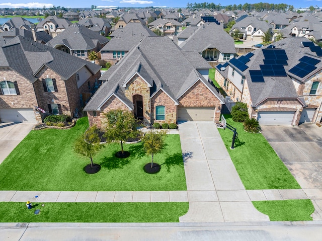 18419 Harlow Dr, Tomball, TX 77377 - view of front of home with a residential view, driveway, stone siding, a shingled roof, and a front lawn