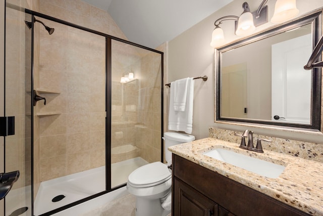 full bath featuring vaulted ceiling, a shower stall, toilet, and vanity