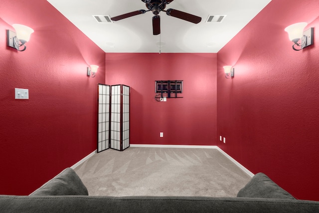 cinema featuring carpet floors, visible vents, baseboards, and a ceiling fan