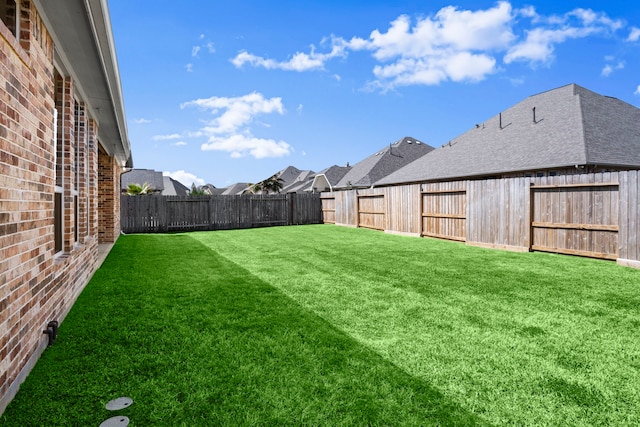 view of yard featuring a fenced backyard