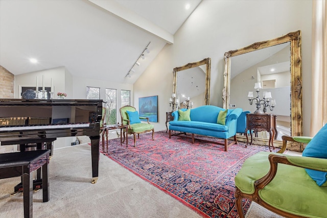 living area with high vaulted ceiling, beamed ceiling, carpet flooring, and track lighting