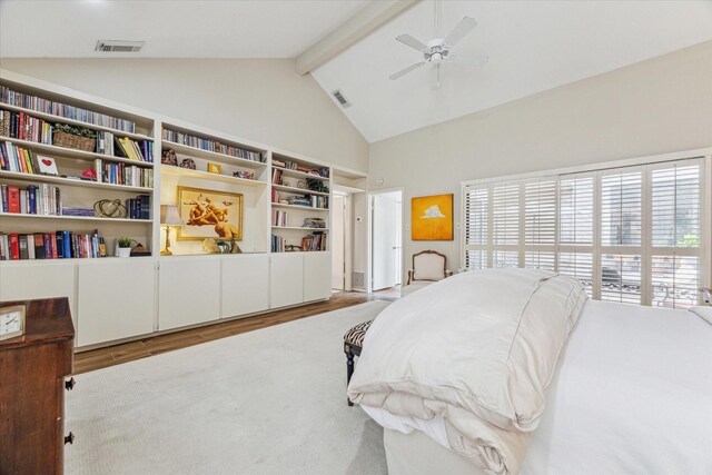 bedroom featuring multiple windows, visible vents, beam ceiling, and wood finished floors