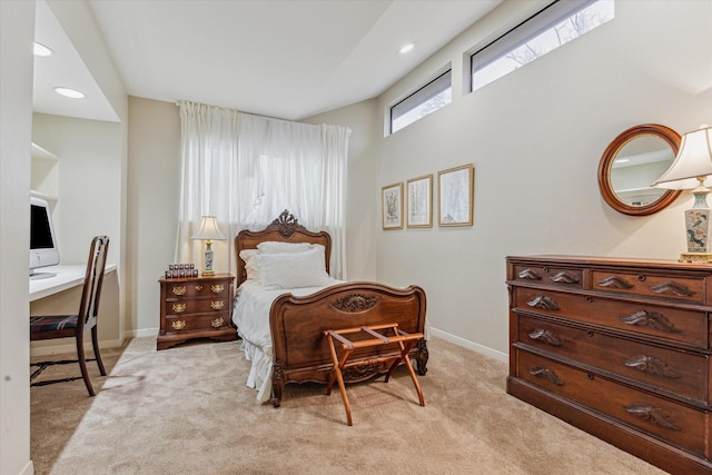 bedroom with recessed lighting, light colored carpet, and baseboards