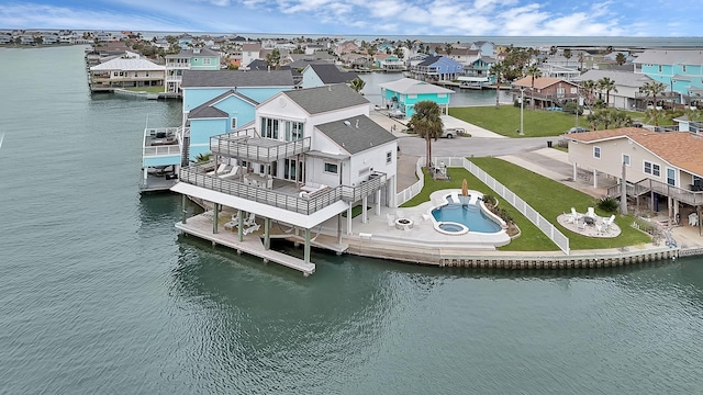 bird's eye view with a water view and a residential view