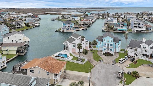 birds eye view of property featuring a water view and a residential view