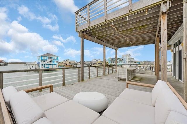 wooden deck featuring a water view