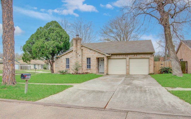 view of front of home with a front yard, brick siding, a chimney, and an attached garage