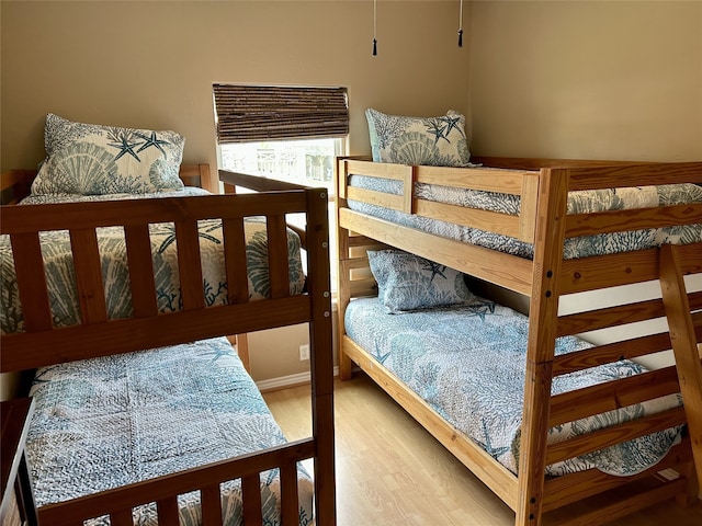 bedroom with wood finished floors