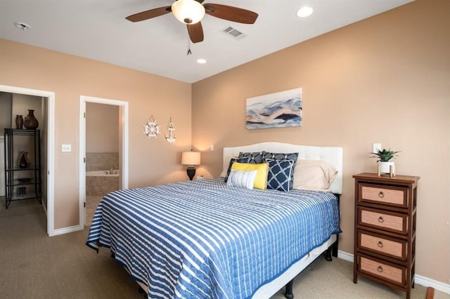 carpeted bedroom with ensuite bath, baseboards, visible vents, and recessed lighting