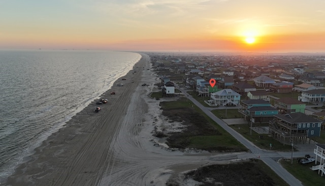 aerial view with a beach view, a residential view, and a water view