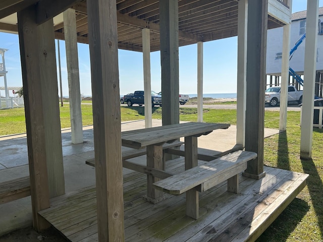 wooden terrace with a yard