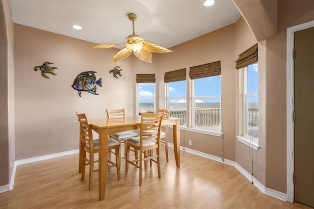 dining area with light wood-style floors, recessed lighting, ceiling fan, and baseboards