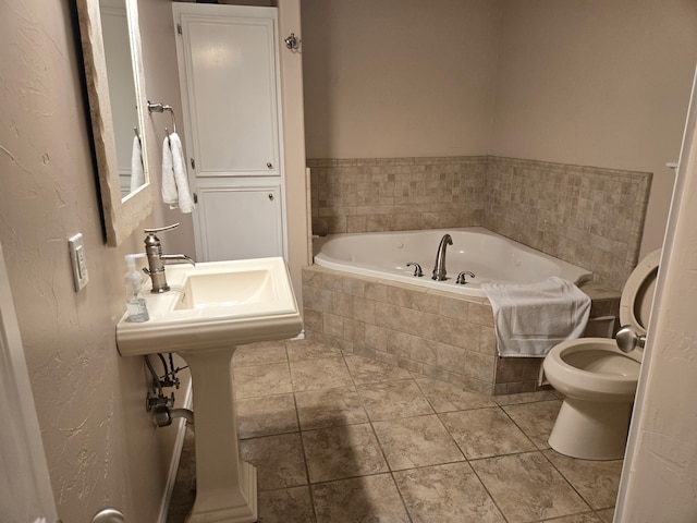 1327 Emerald Dr, Crystal Beach, TX 77650 - bathroom featuring a bath and toilet