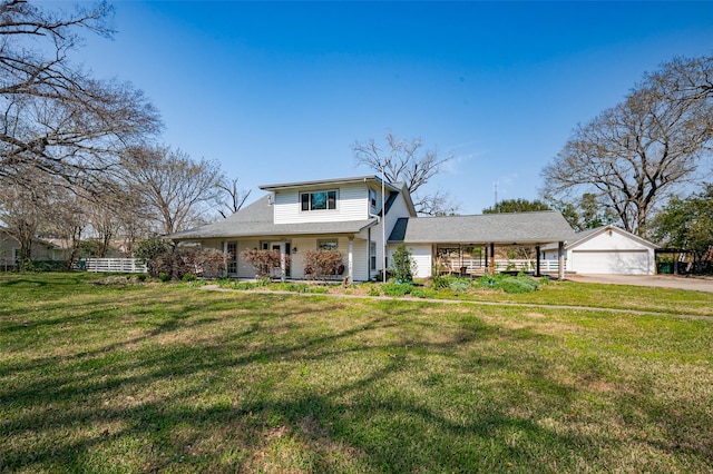 view of front facade with a porch, a garage, and a front lawn