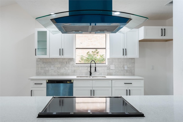 kitchen with tasteful backsplash, white cabinets, a sink, island range hood, and dishwasher