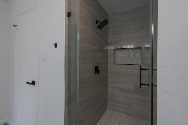 bathroom featuring a shower stall