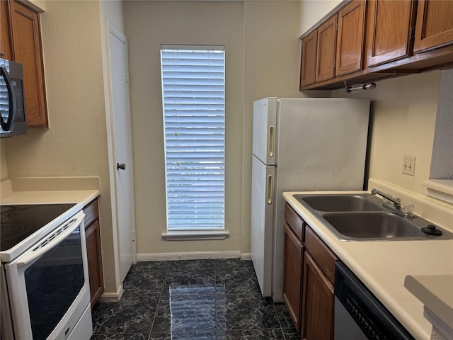 2120 El Paseo St Unit 3301, Houston, TX 77054 - kitchen with stainless steel appliances, brown cabinets, light countertops, and dark marble finish floors