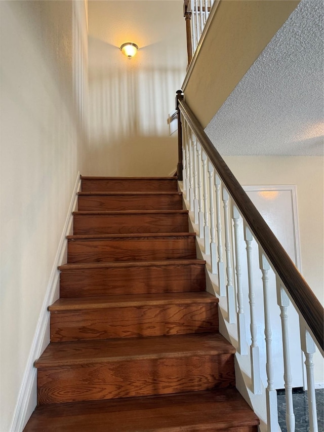 2120 El Paseo St Unit 3301, Houston, TX 77054 - staircase featuring baseboards