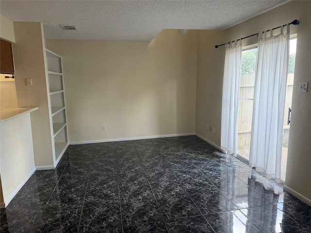 2120 El Paseo St Unit 3301, Houston, TX 77054 - unfurnished living room with a textured ceiling and marble finish flooring