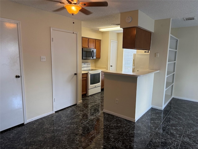 2120 El Paseo St Unit 3301, Houston, TX 77054 - kitchen with white appliances, a ceiling fan, light countertops, a peninsula, and brown cabinetry