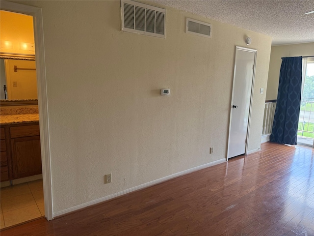 2120 El Paseo St Unit 3301, Houston, TX 77054 - unfurnished room with wood finished floors and a textured ceiling
