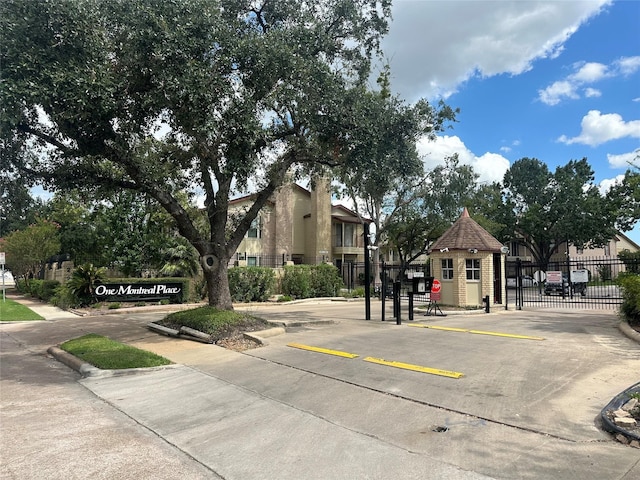 2120 El Paseo St Unit 3301, Houston, TX 77054 - view of concrete street featuring traffic signs, a gated entry, and curbs