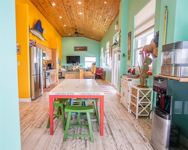 dining space featuring recessed lighting, light wood-style floors, wood ceiling, vaulted ceiling, and ceiling fan