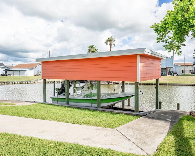 exterior space featuring a yard, a dock, a water view, and boat lift