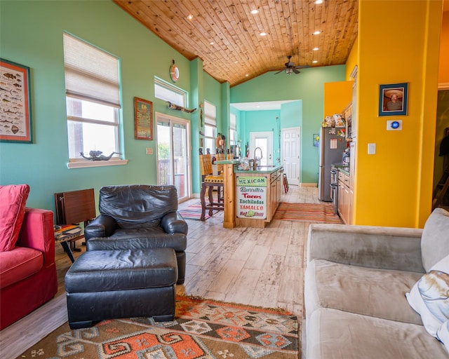 living room with a ceiling fan, lofted ceiling, wooden ceiling, light wood-style flooring, and recessed lighting