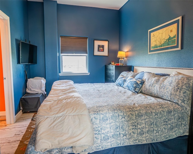 bedroom with wood finished floors