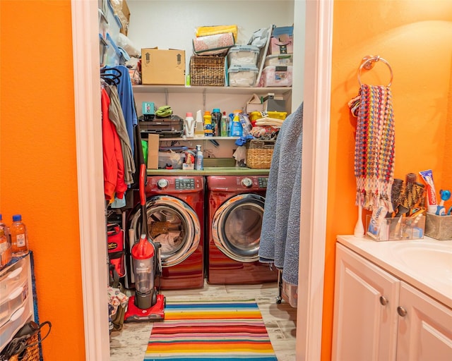 washroom with laundry area and independent washer and dryer